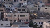 Israeli soldiers pushed three apparently lifeless bodies from roofs during West Bank raid.mp4